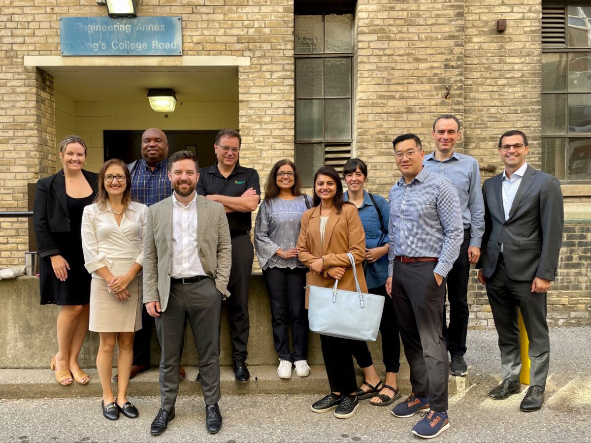 Climate Positive Energy and Toronto Hydro team members pose for a photo in the Engineering Annex